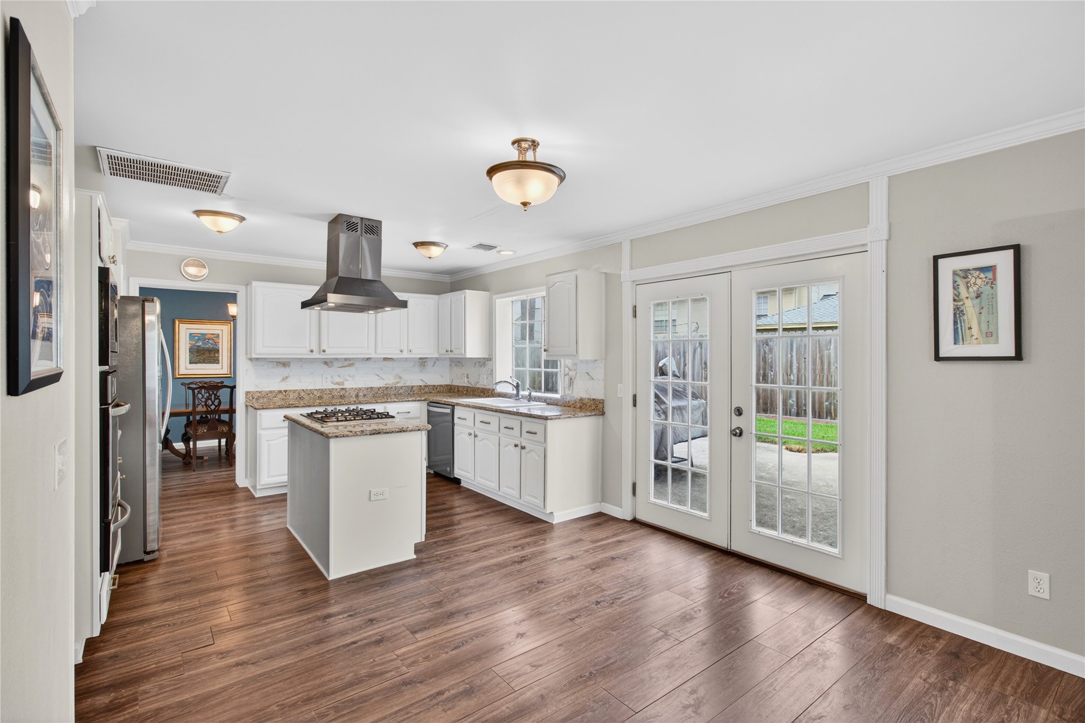20214 Woodsboro Court Spring, TX 77388 - Photo 15 of 50 Breakfast Area! Recently Updated Kitchen! Painted cabinets, Stainless Appliances & Vent Hood, Tile Backsplash! Recently Painted Interior! Luxury Vinyl Plank throughout 1st Floor!