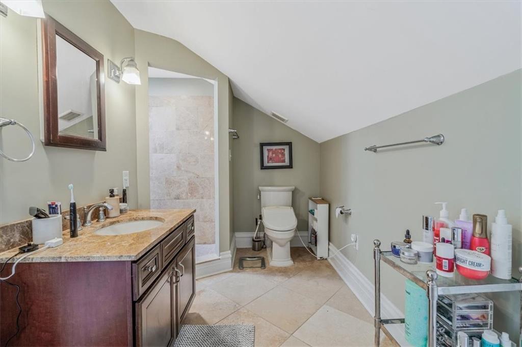 1417 Monterey Street Pittsburgh, PA 15212 - Photo 35 of 50 a bathroom with a sink mirror vanity and toilet