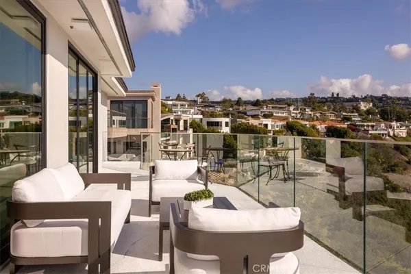 a view of swimming pool with outdoor seating