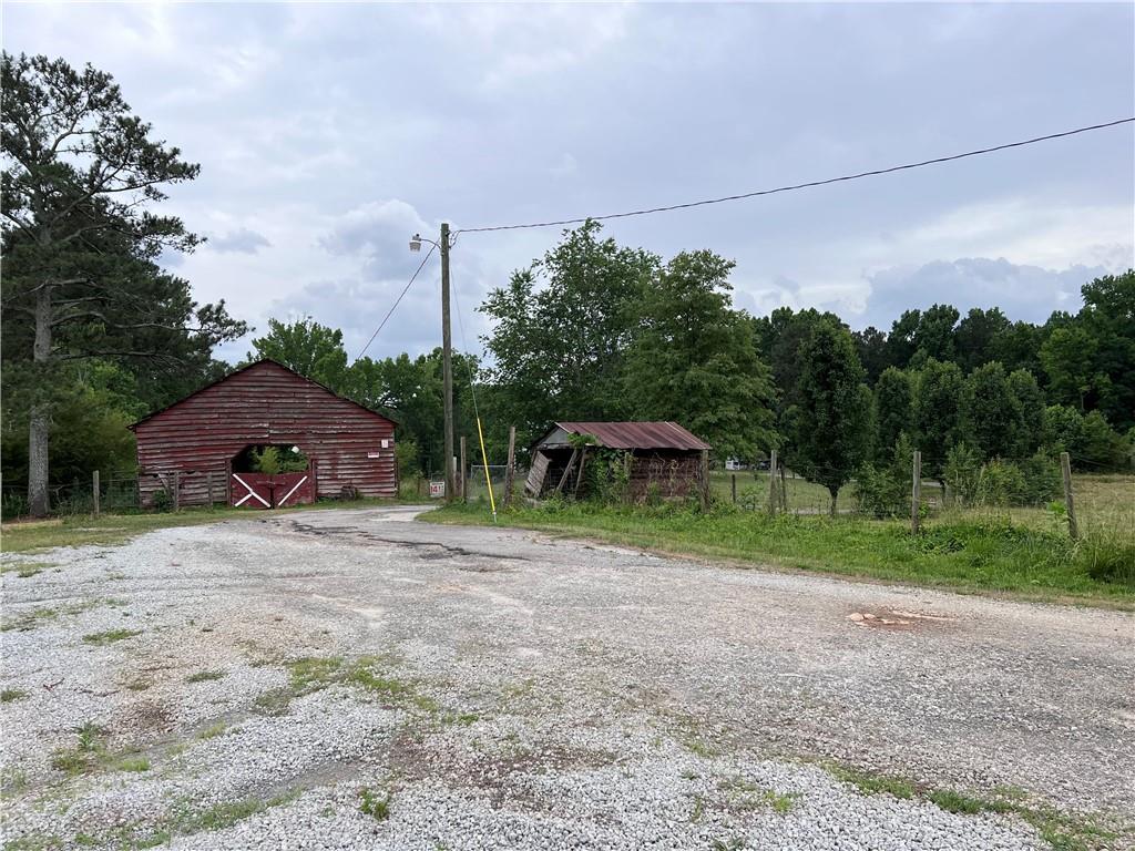 1405 Rock Springs Road Buford, GA 30519 - Photo 14 of 45 a backyard of a house with lots of green space