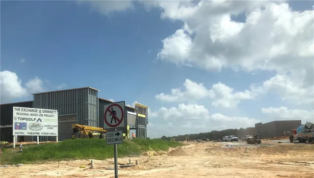 a view of a street with cars on the road