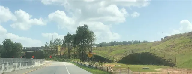 a couple of cars parked in front of a building