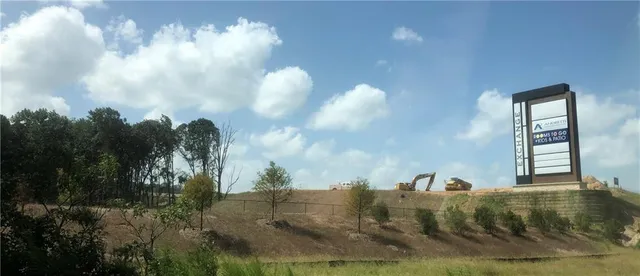 a view of swimming pool with a yard