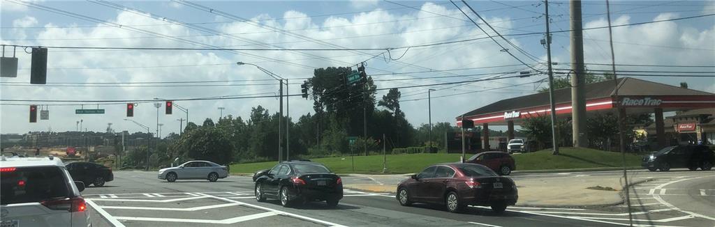 1405 Rock Springs Road Buford, GA 30519 - Photo 9 of 45 a view of a patio with table and chairs and potted plants