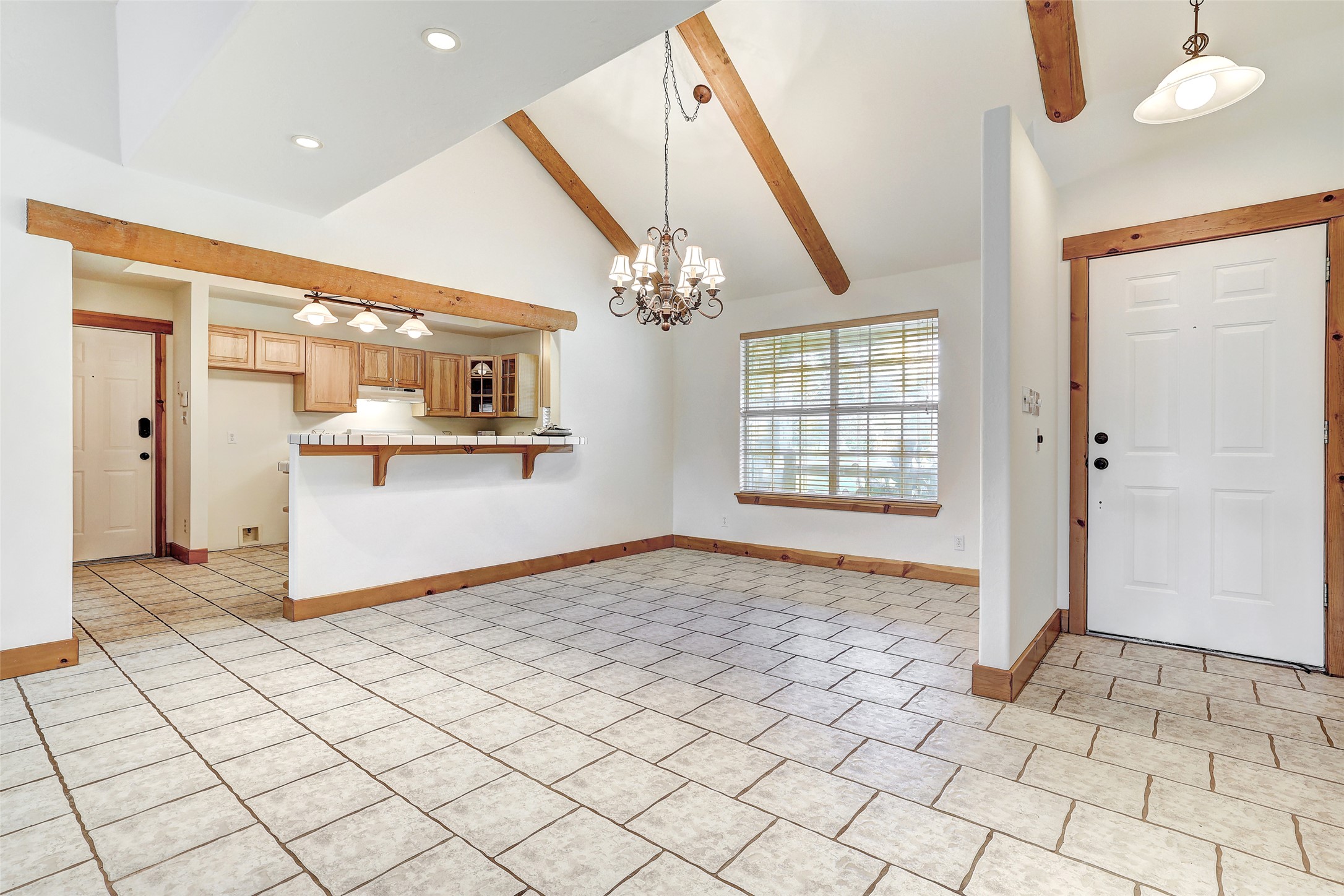 125 Kyle Lane Georgetown, TX 78633 - Photo 11 of 34 Entryway featuring lofted ceiling and suspended lighting