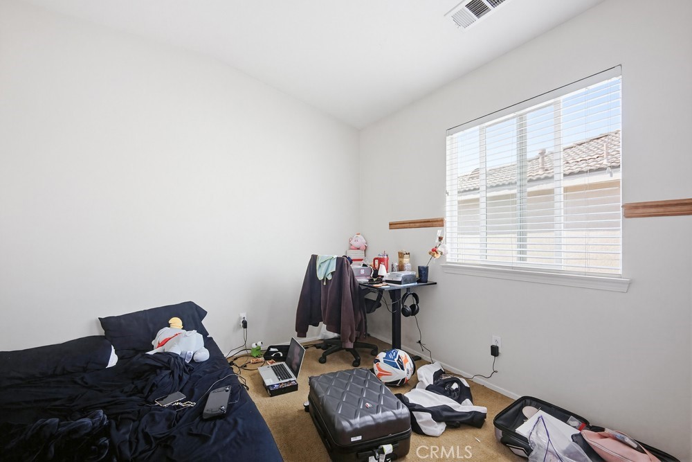 1747 Palermo Drive Riverside, CA 92507 - Photo 21 of 30 a room with furniture and window