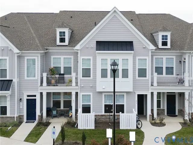 a front view of a building with a yard