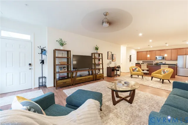 a living room with furniture and a flat screen tv