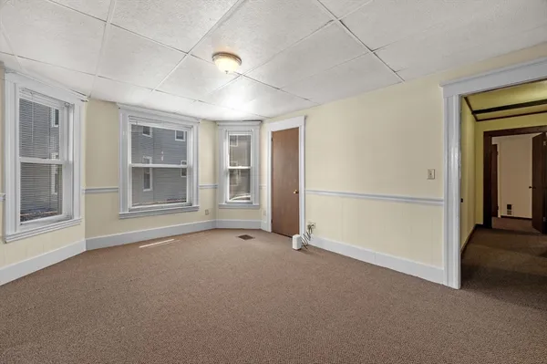 a view of an empty room with a window