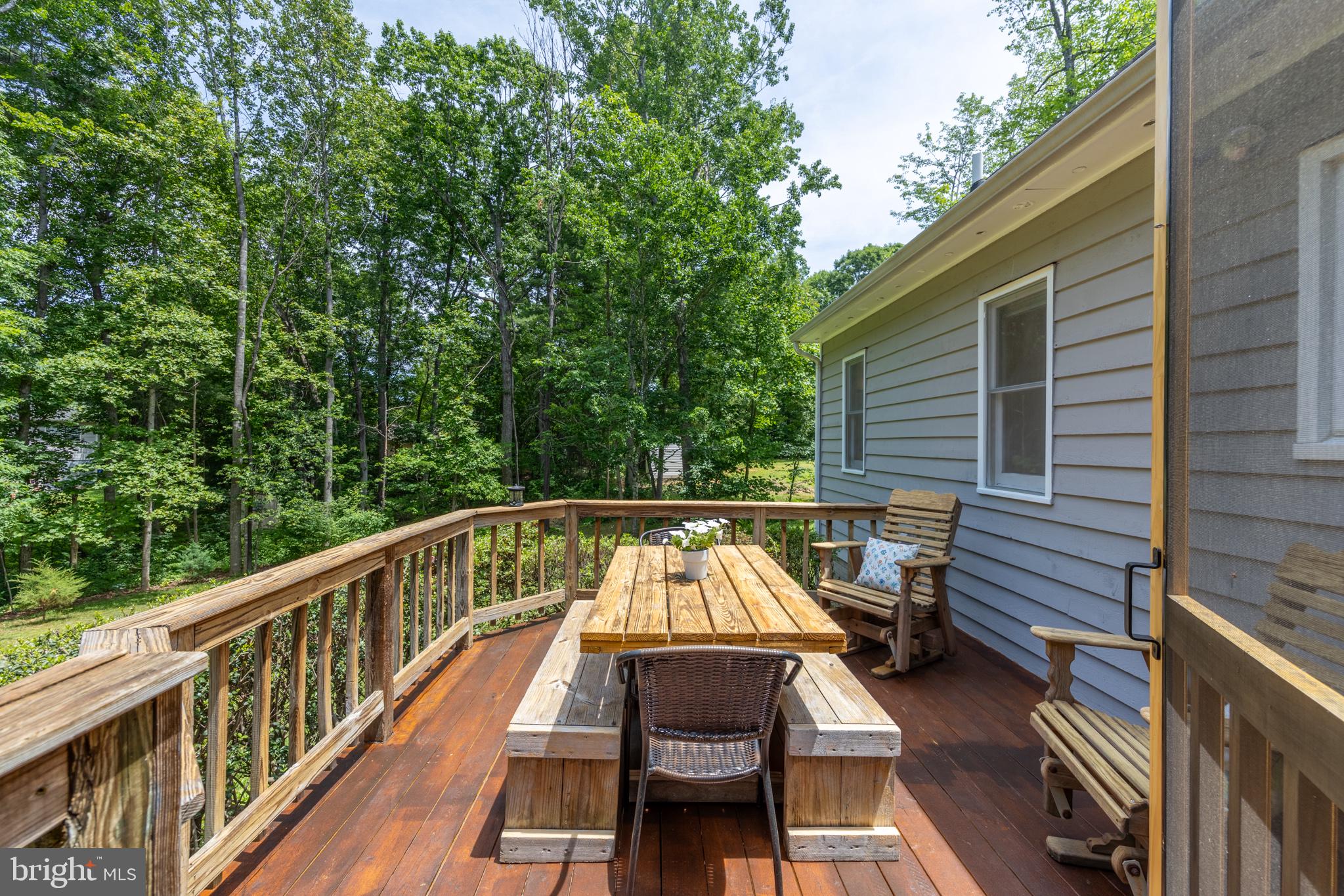 164 Oliver Lane Ruckersville, VA 22968 - Photo 8 of 39 Serene deck nestled in lush greenery.