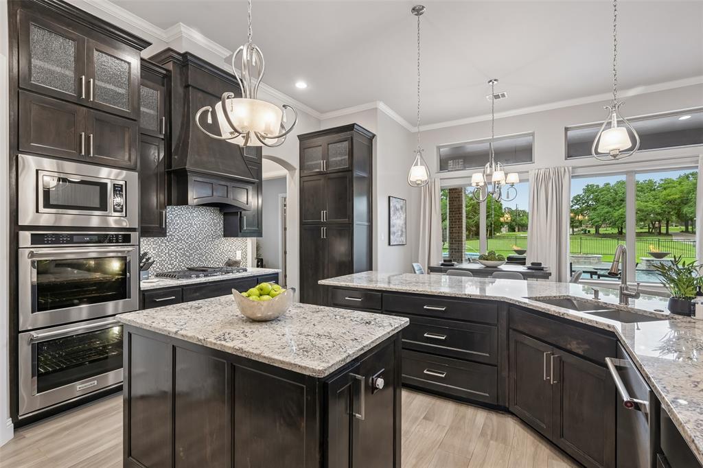 1657 Florence Road Keller, TX 76262 - Photo 14 of 40 a kitchen with a sink a counter top space cabinets and stainless steel appliances