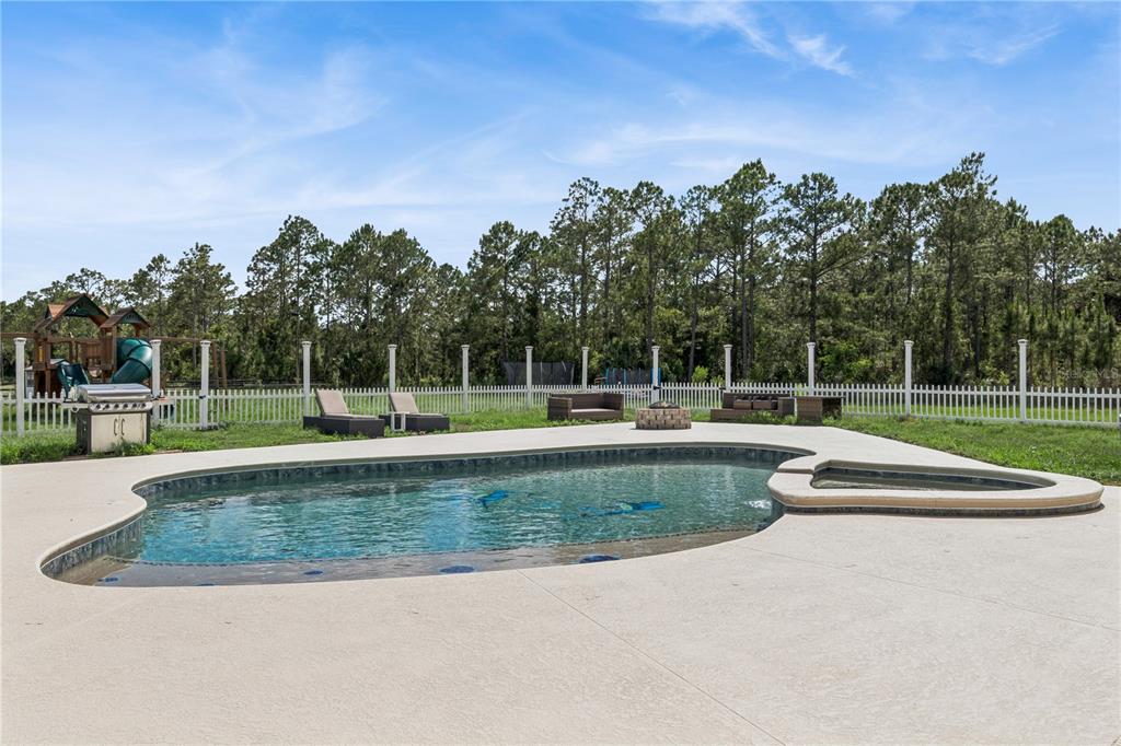 345 Cypress Isles Road Osteen, FL 32764 - Photo 26 of 41 a view of a fountain in front of a house