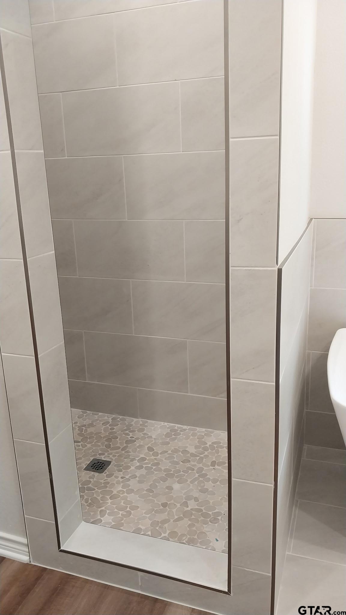 1262 George Richey Road Gladewater, TX 75647 - Photo 14 of 22 a bathroom with a shower