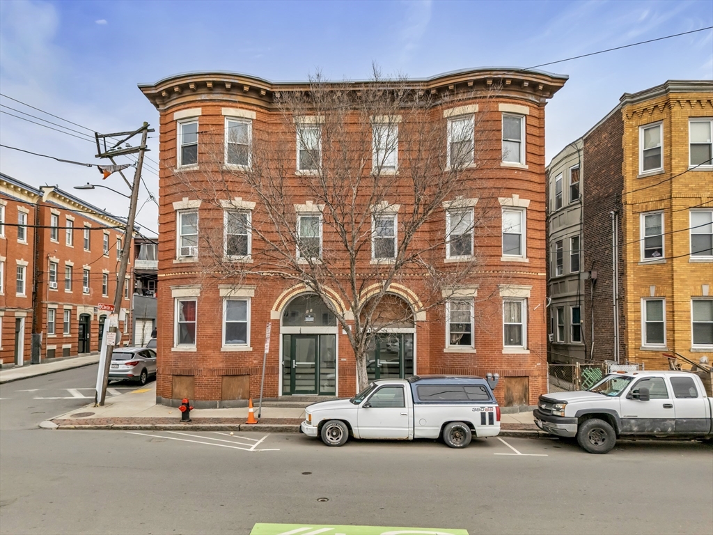 139 Hawthorne Street Chelsea, MA 02150 - Photo 1 of 17 a car parked in front of a building