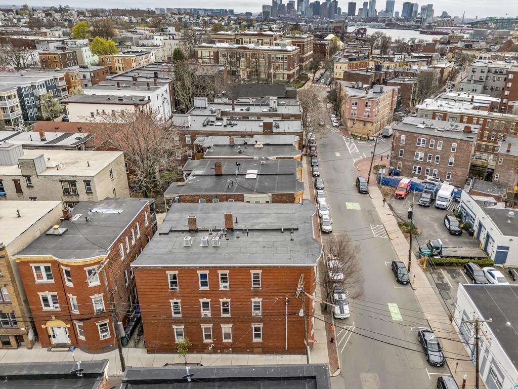 139 Hawthorne Street Chelsea, MA 02150 - Photo 5 of 17 an aerial view of residential houses with outdoor space