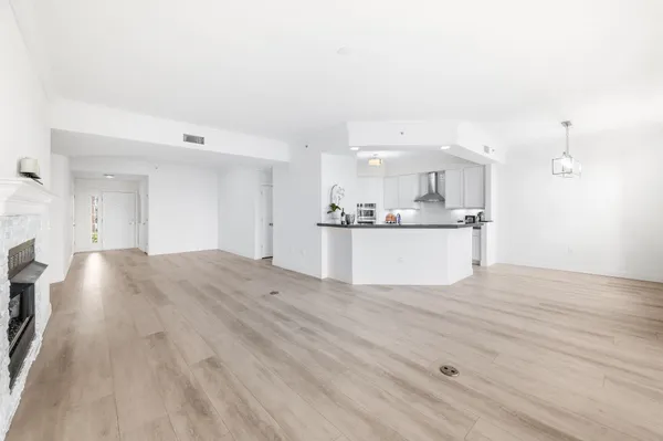a kitchen with stainless steel appliances a sink stove and cabinets