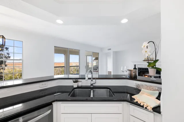 a stove top oven sitting inside of a kitchen