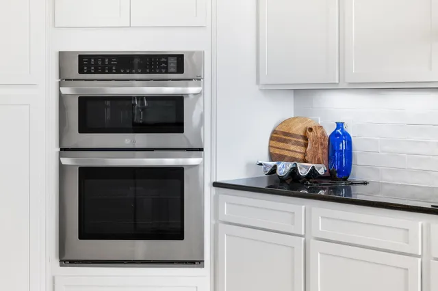 a kitchen with a sink and a fireplace