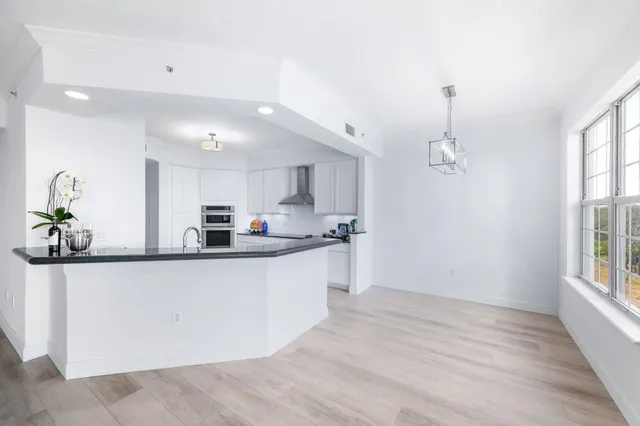 a view of a bathroom with a glass door shower
