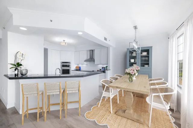 a very nice looking dining room with a table and chairs in it