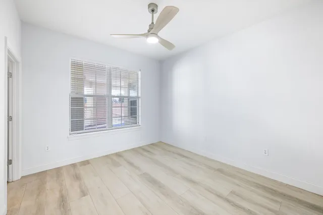 a view of a swimming pool with a table and chairs