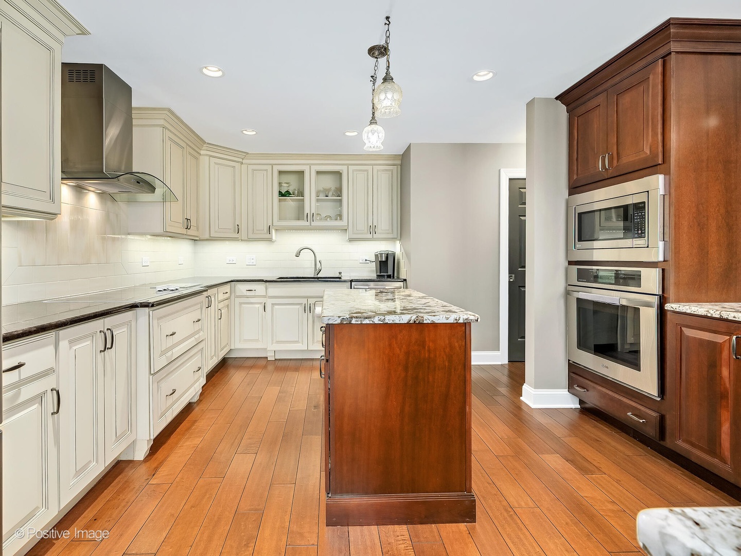 1401 Burr Oak Road, Unit 114B Hinsdale, IL 60521 - Photo 16 of 40 a large kitchen with stainless steel appliances granite countertop a stove a sink and a refrigerator