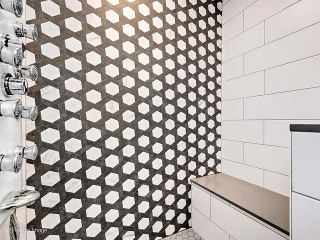 a bathroom with a sink and a large mirror