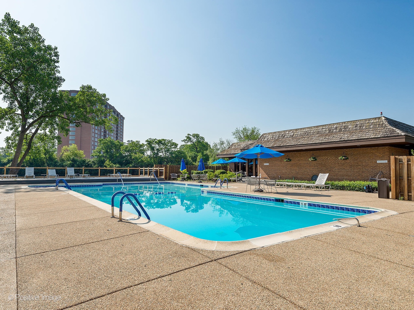 1401 Burr Oak Road, Unit 114B Hinsdale, IL 60521 - Photo 34 of 40 a view of a swimming pool with lounge chairs