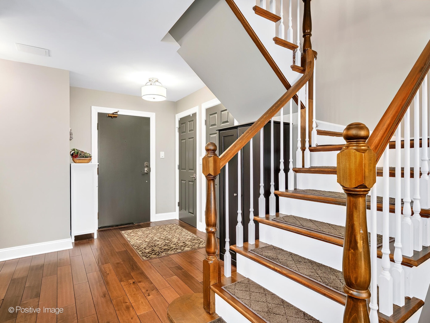 1401 Burr Oak Road, Unit 114B Hinsdale, IL 60521 - Photo 7 of 40 a view of an entryway with wooden floor and stairs