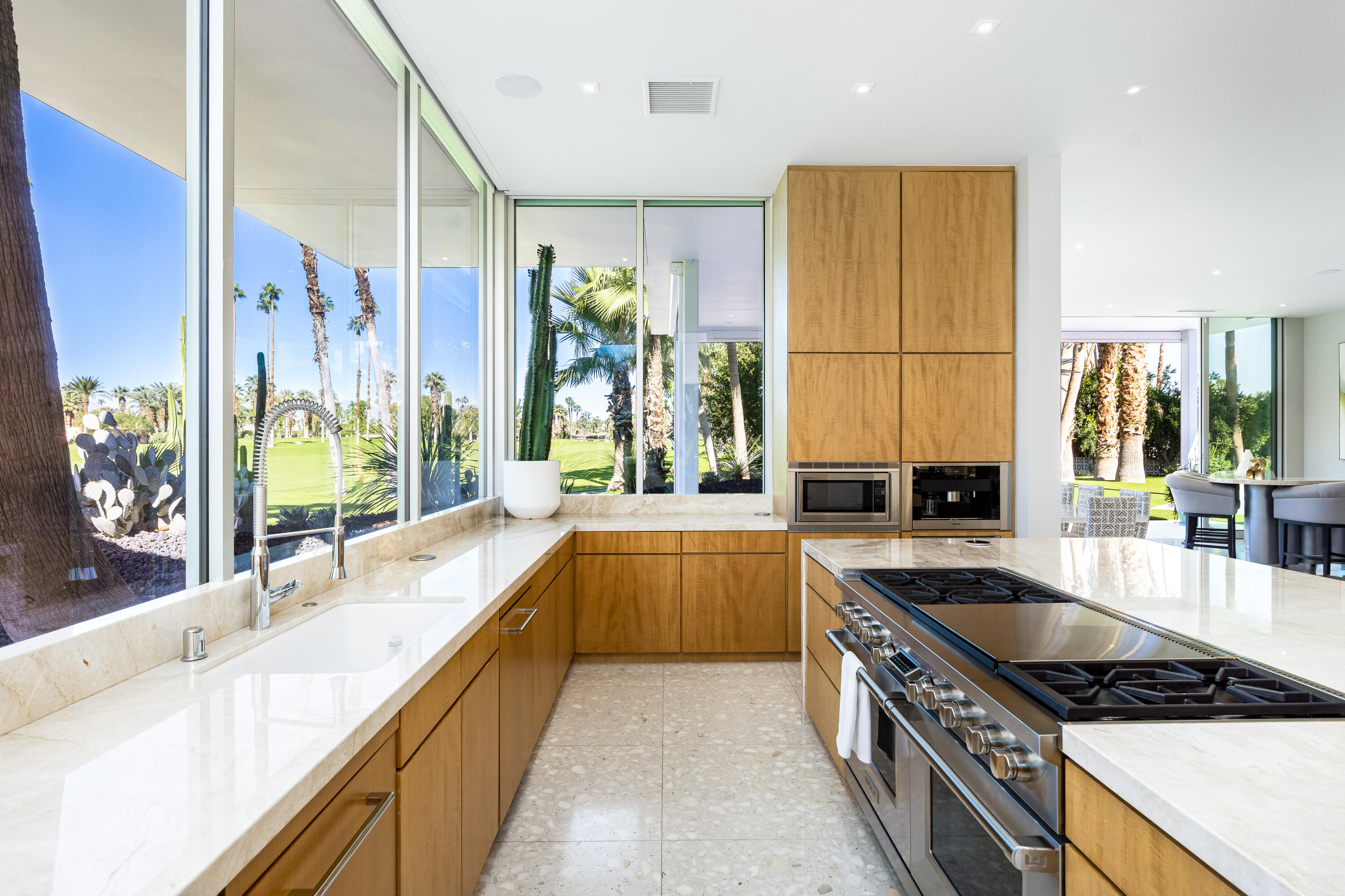 40365 Sand Dune Road Rancho Mirage, CA 92270 - Photo 32 of 70 a large kitchen with stainless steel appliances granite countertop a sink and cabinets