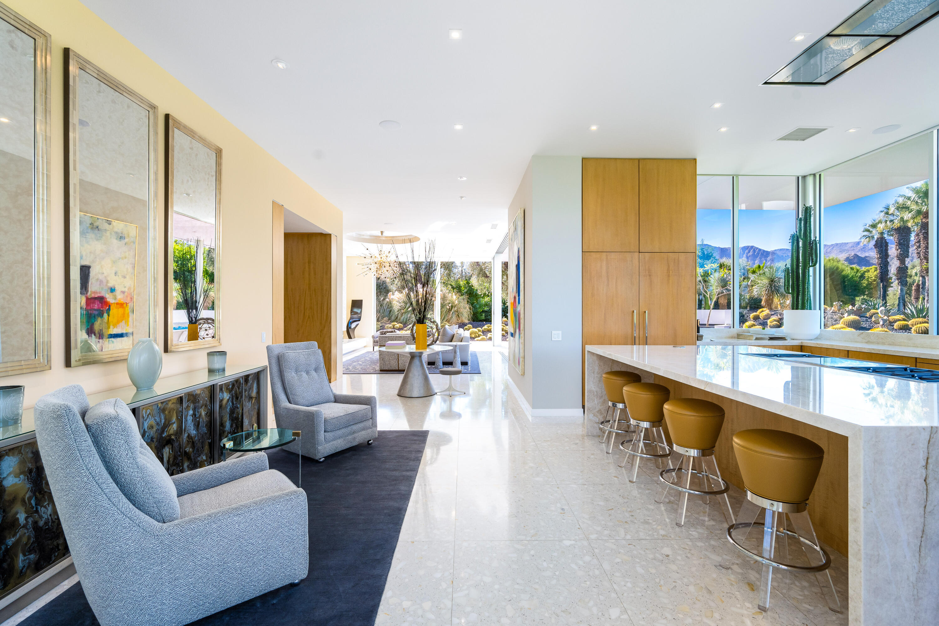 40365 Sand Dune Road Rancho Mirage, CA 92270 - Photo 34 of 70 a large living room with stainless steel appliances kitchen island granite countertop furniture a sink and a large mirror