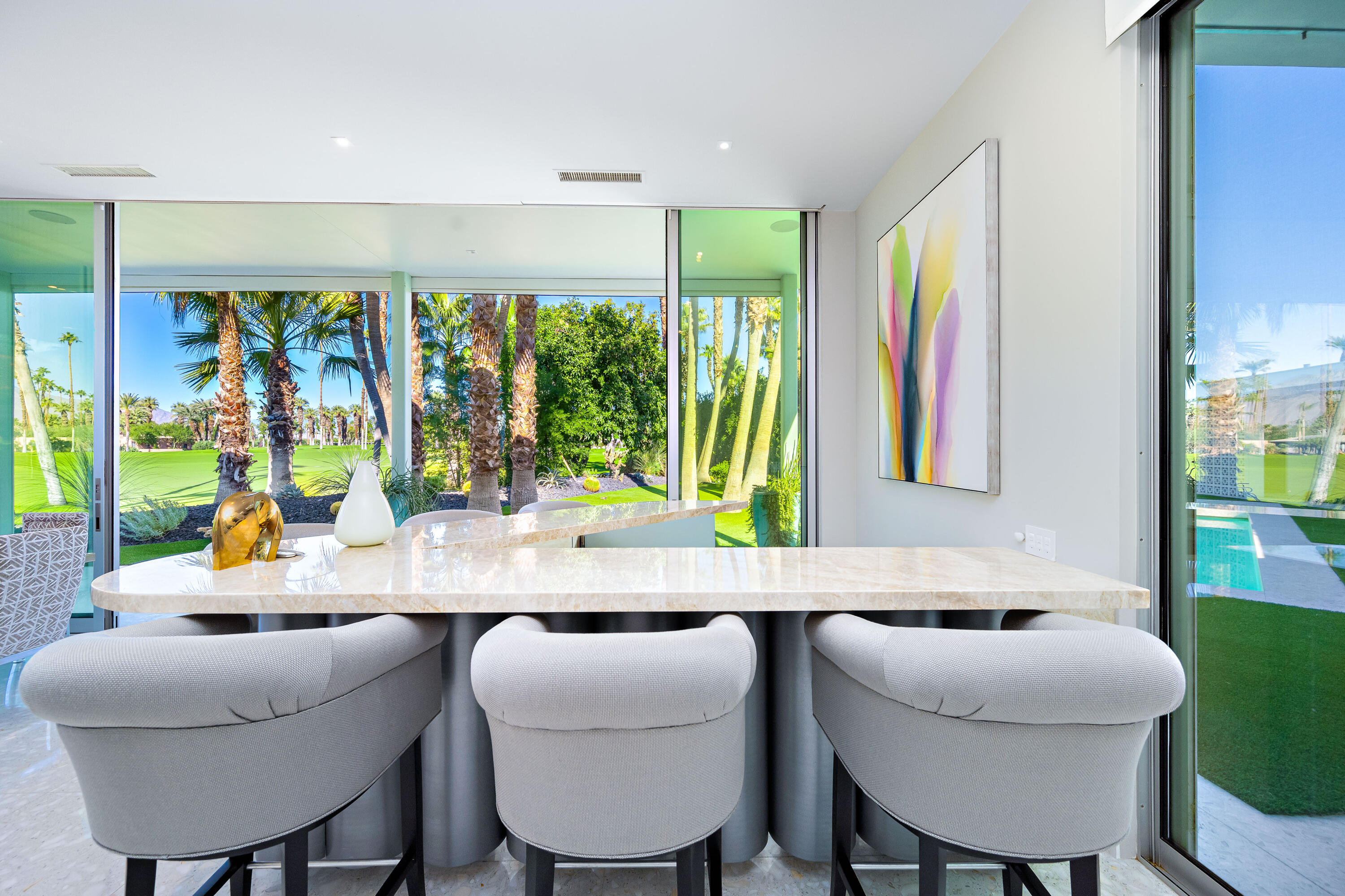 40365 Sand Dune Road Rancho Mirage, CA 92270 - Photo 38 of 70 a room with a table chairs and a large window