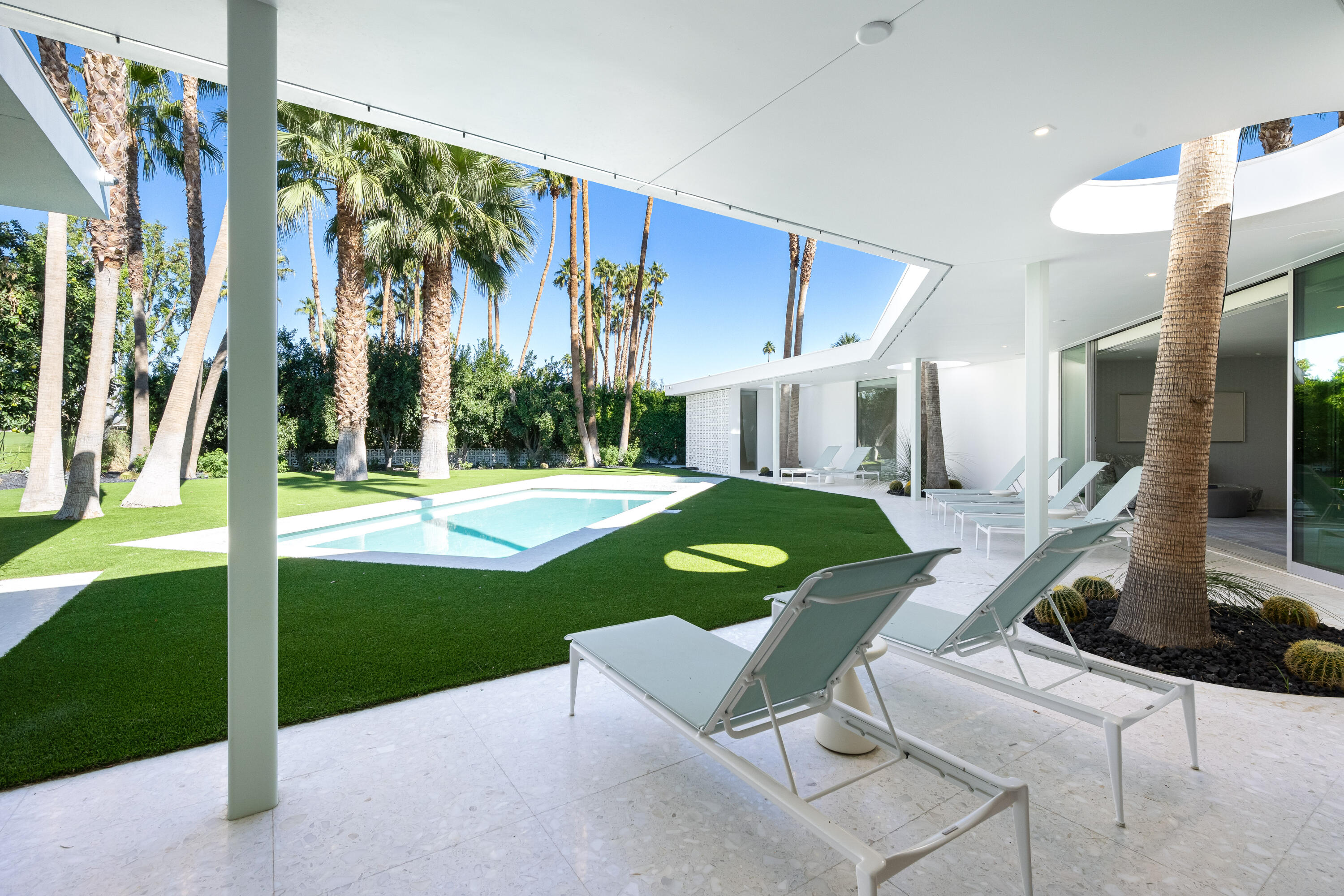 40365 Sand Dune Road Rancho Mirage, CA 92270 - Photo 66 of 70 a view of a house with a swimming pool and sitting area