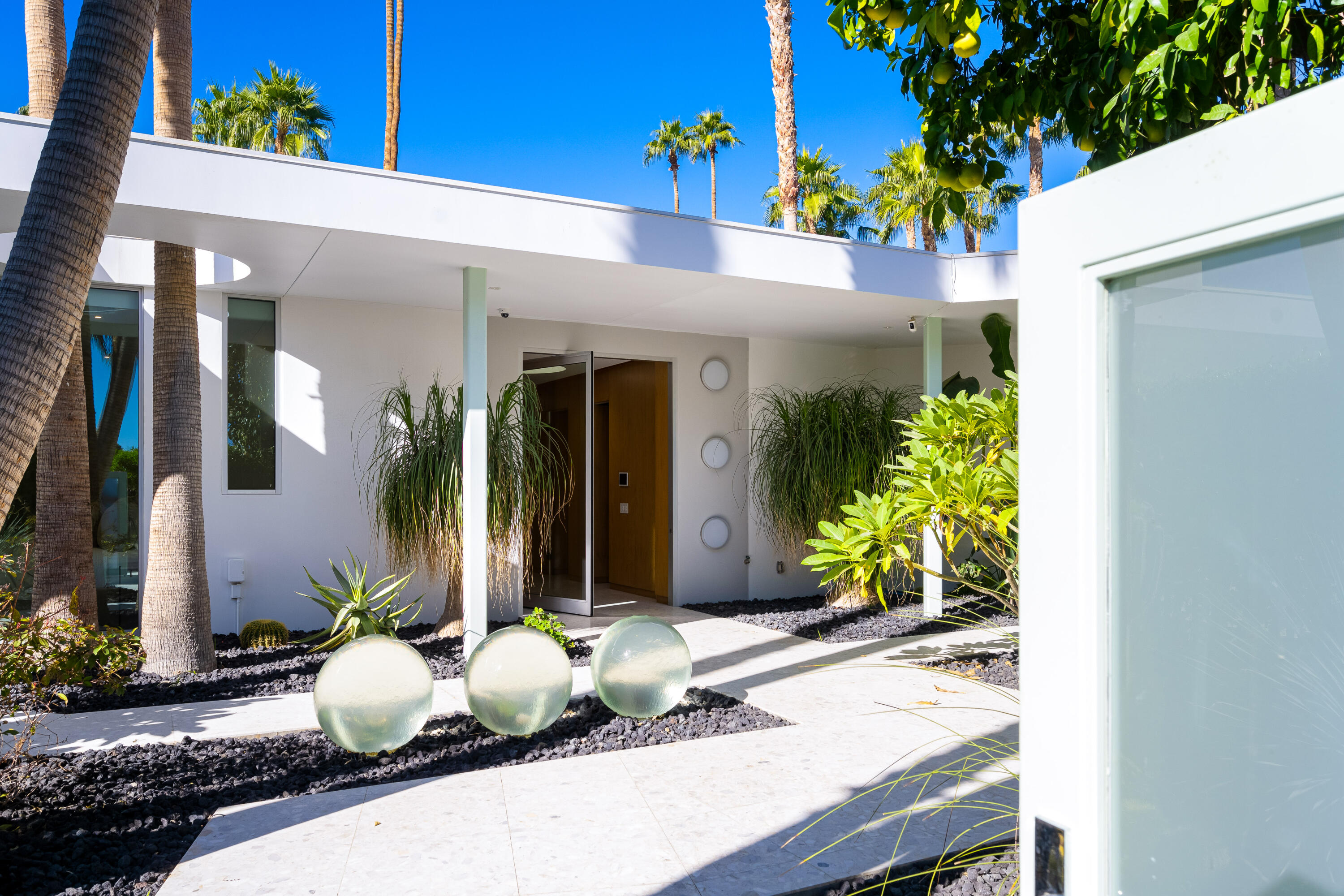 40365 Sand Dune Road Rancho Mirage, CA 92270 - Photo 8 of 70 a potted plant sitting in front of a house
