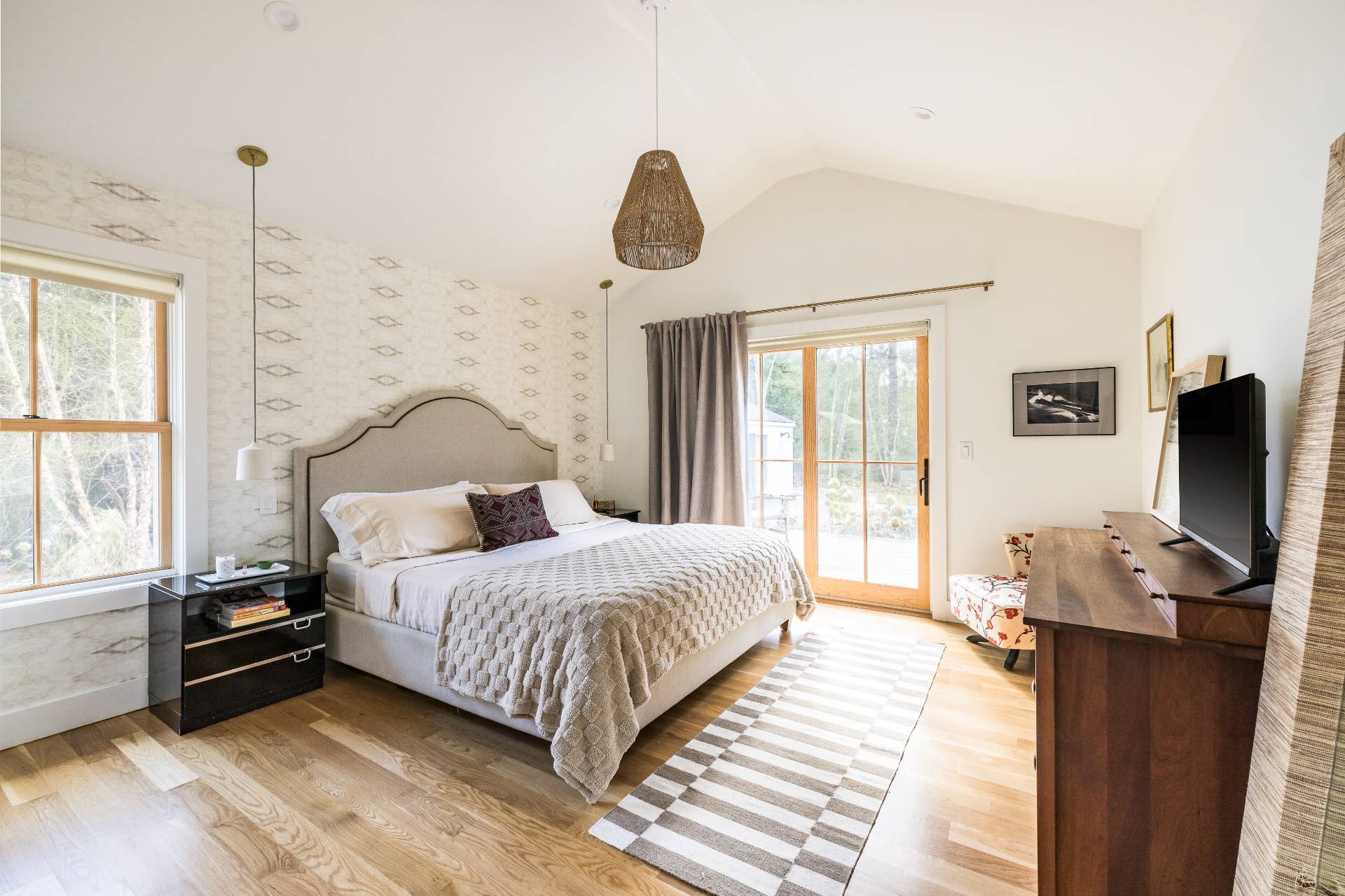 264 Kings Point Road East Hampton, NY 11937 - Photo 8 of 30 a bedroom with a bed a flat screen tv and a window