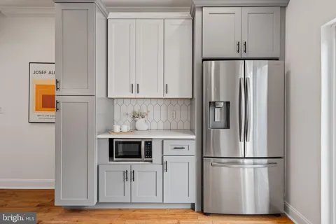 a white refrigerator freezer sitting in a kitchen