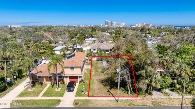 a view of multiple houses with a street