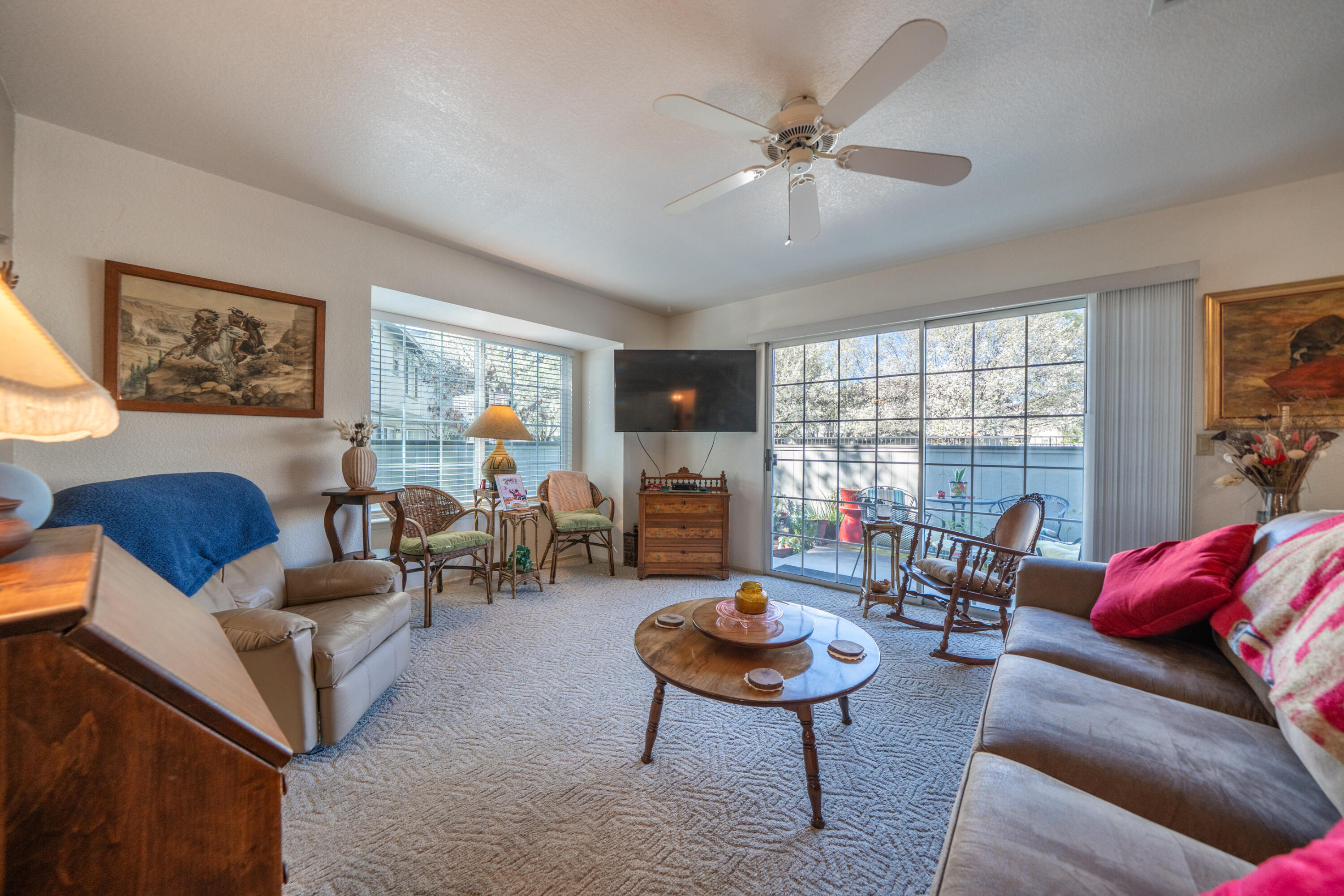 200 Ridgetop Drive, Unit 19 Redding, CA 96003 - Photo 12 of 53 a living room with furniture and a large window