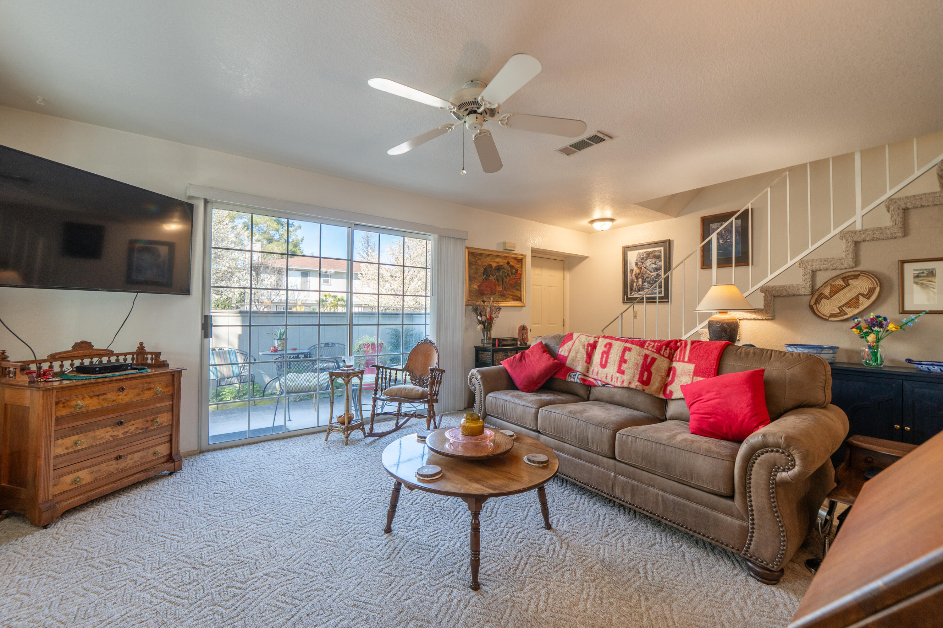 200 Ridgetop Drive, Unit 19 Redding, CA 96003 - Photo 13 of 53 a living room with furniture and a flat screen tv