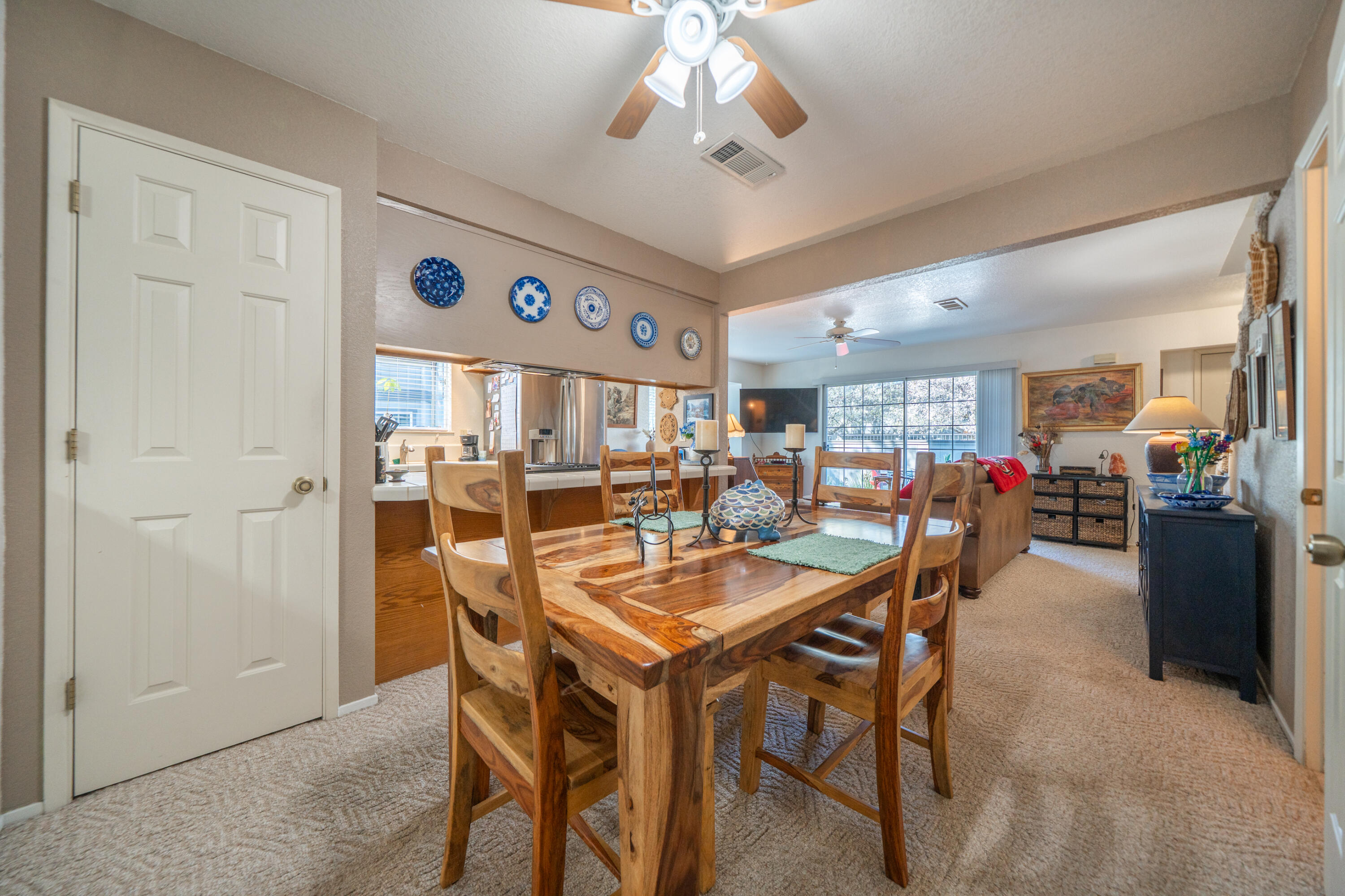 200 Ridgetop Drive, Unit 19 Redding, CA 96003 - Photo 17 of 53 a dining room with a wooden table and chairs