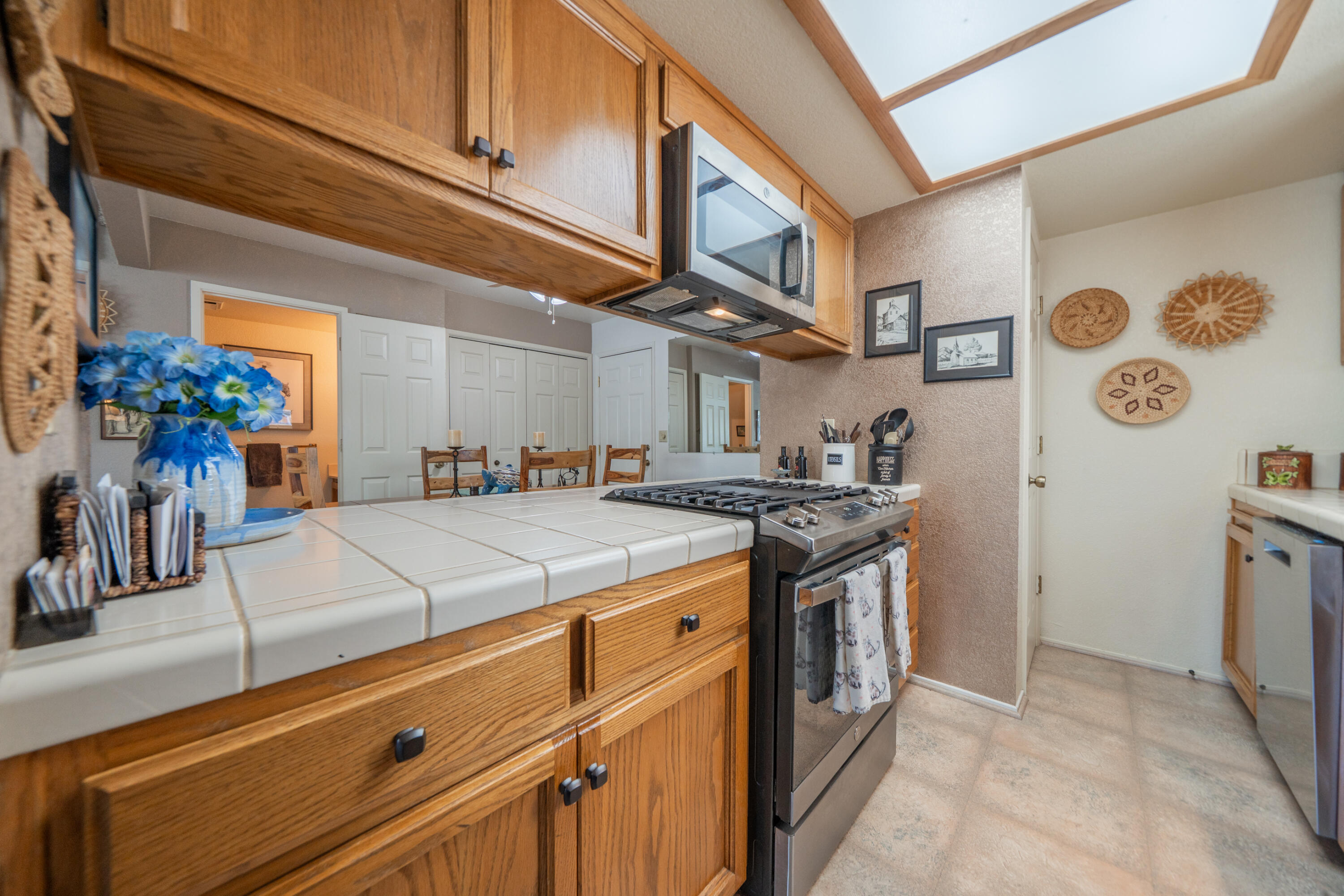 200 Ridgetop Drive, Unit 19 Redding, CA 96003 - Photo 18 of 53 a kitchen with stainless steel appliances granite countertop a stove and a refrigerator