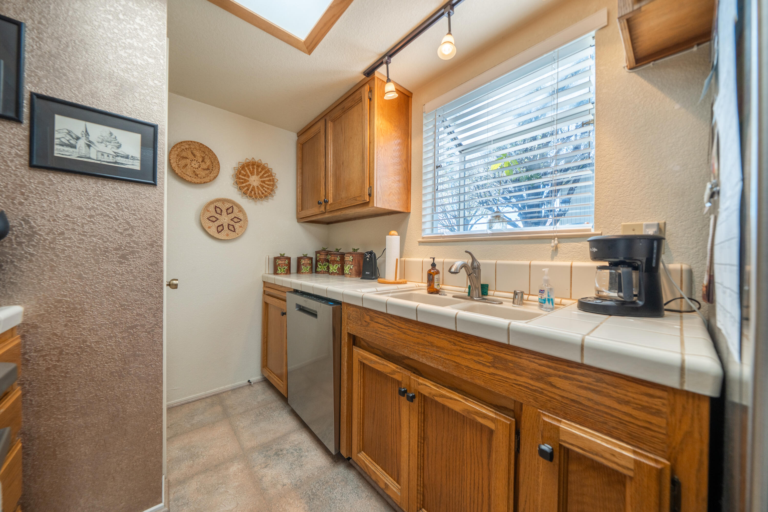 200 Ridgetop Drive, Unit 19 Redding, CA 96003 - Photo 19 of 53 a kitchen with a sink cabinets and window