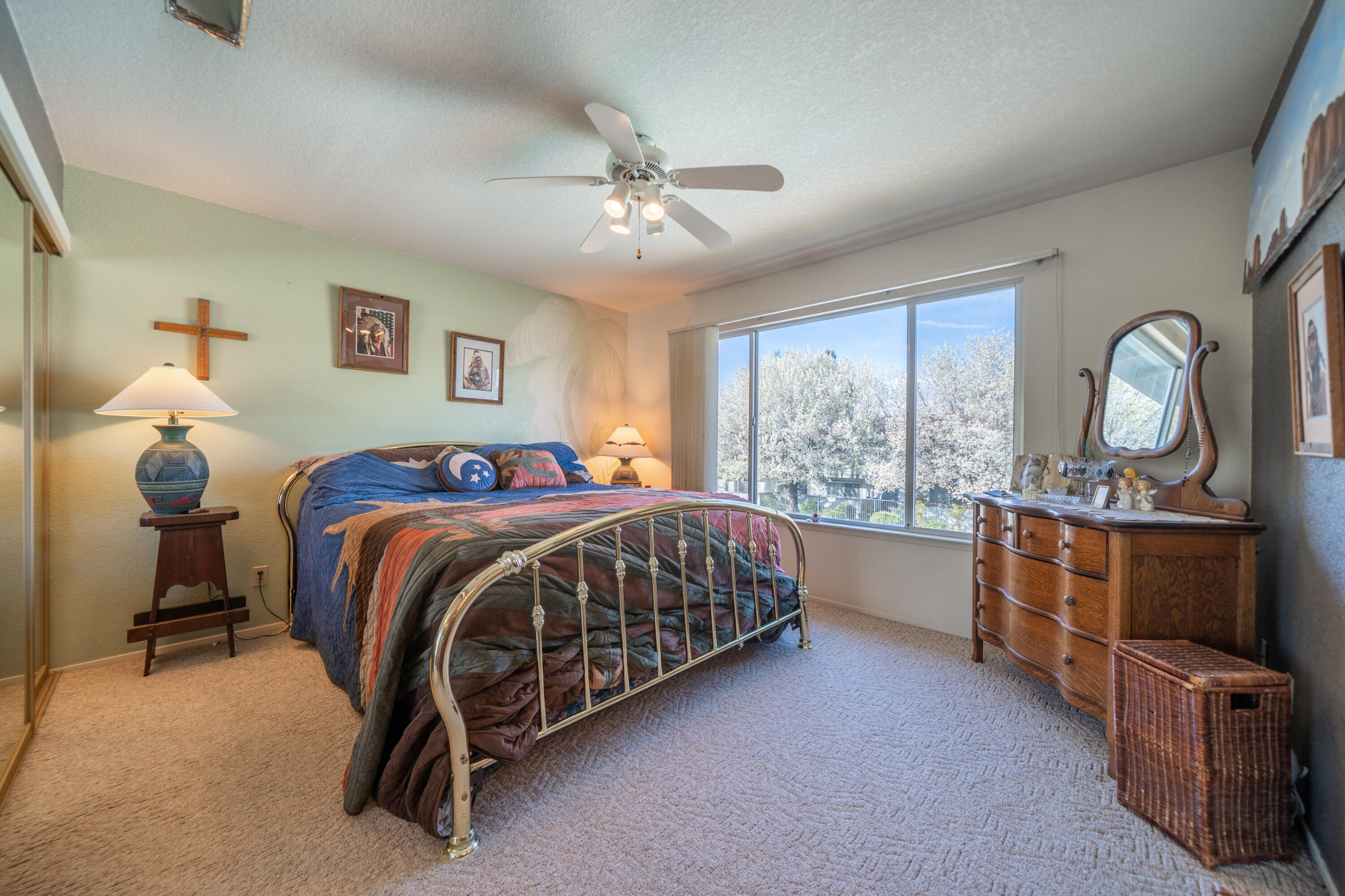 200 Ridgetop Drive, Unit 19 Redding, CA 96003 - Photo 23 of 53 a bed room with a bed and a dresser