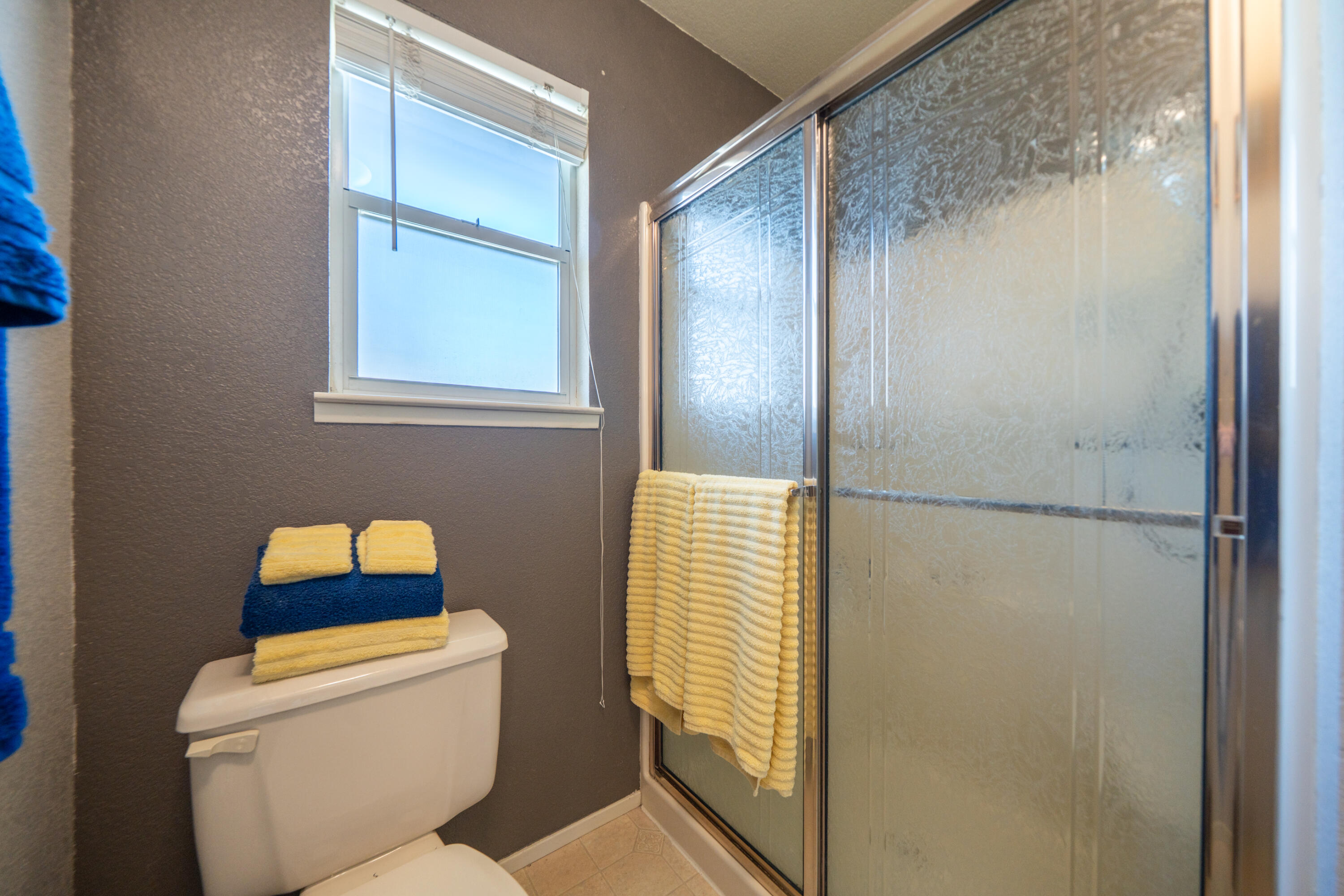 200 Ridgetop Drive, Unit 19 Redding, CA 96003 - Photo 26 of 53 a bathroom with a toilet and a shower