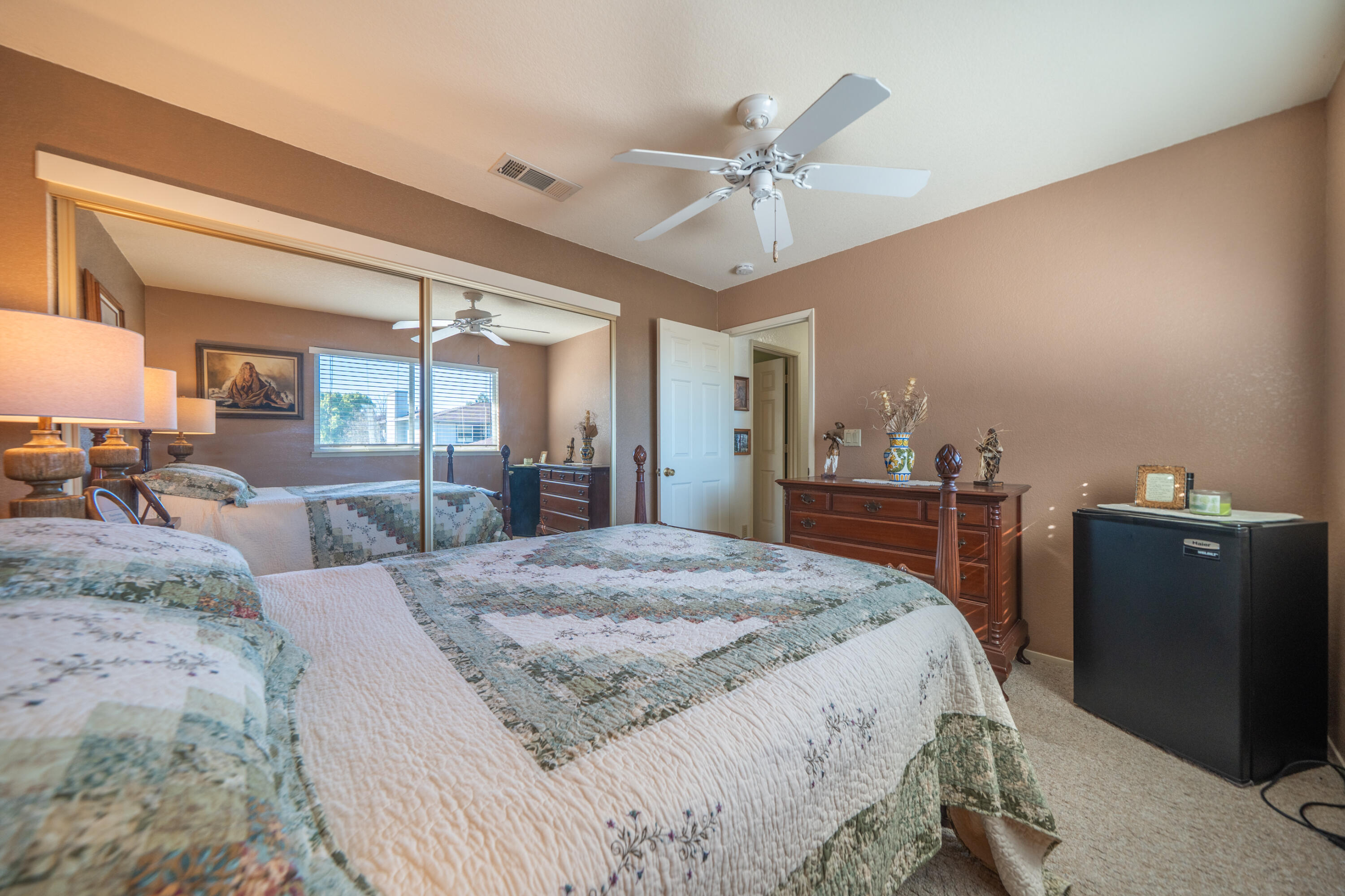 200 Ridgetop Drive, Unit 19 Redding, CA 96003 - Photo 28 of 53 a bed room with a bed and a mirror