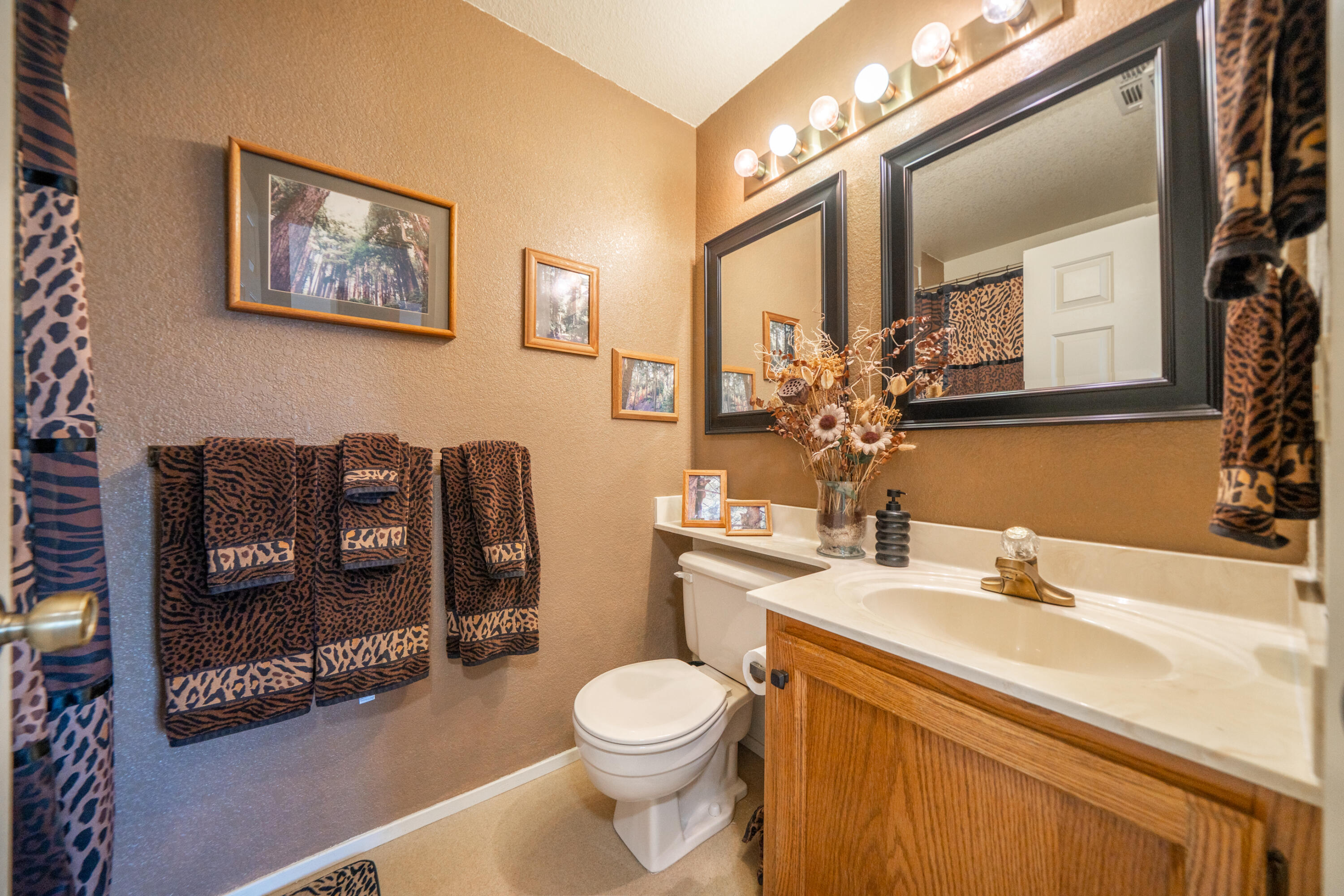 200 Ridgetop Drive, Unit 19 Redding, CA 96003 - Photo 29 of 53 a bathroom with a toilet a sink and mirror