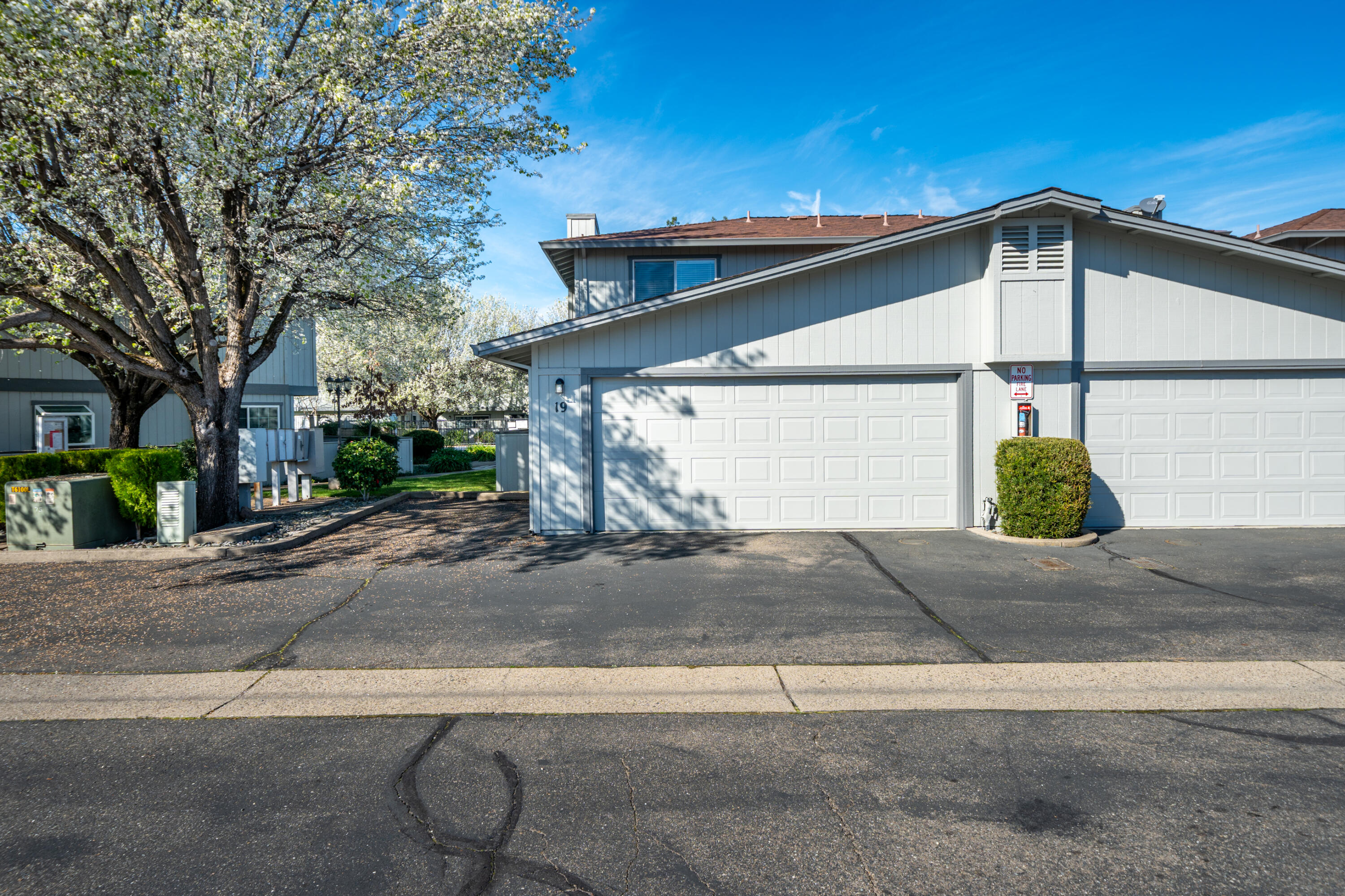 200 Ridgetop Drive, Unit 19 Redding, CA 96003 - Photo 3 of 53 a view of a house with a yard and garage