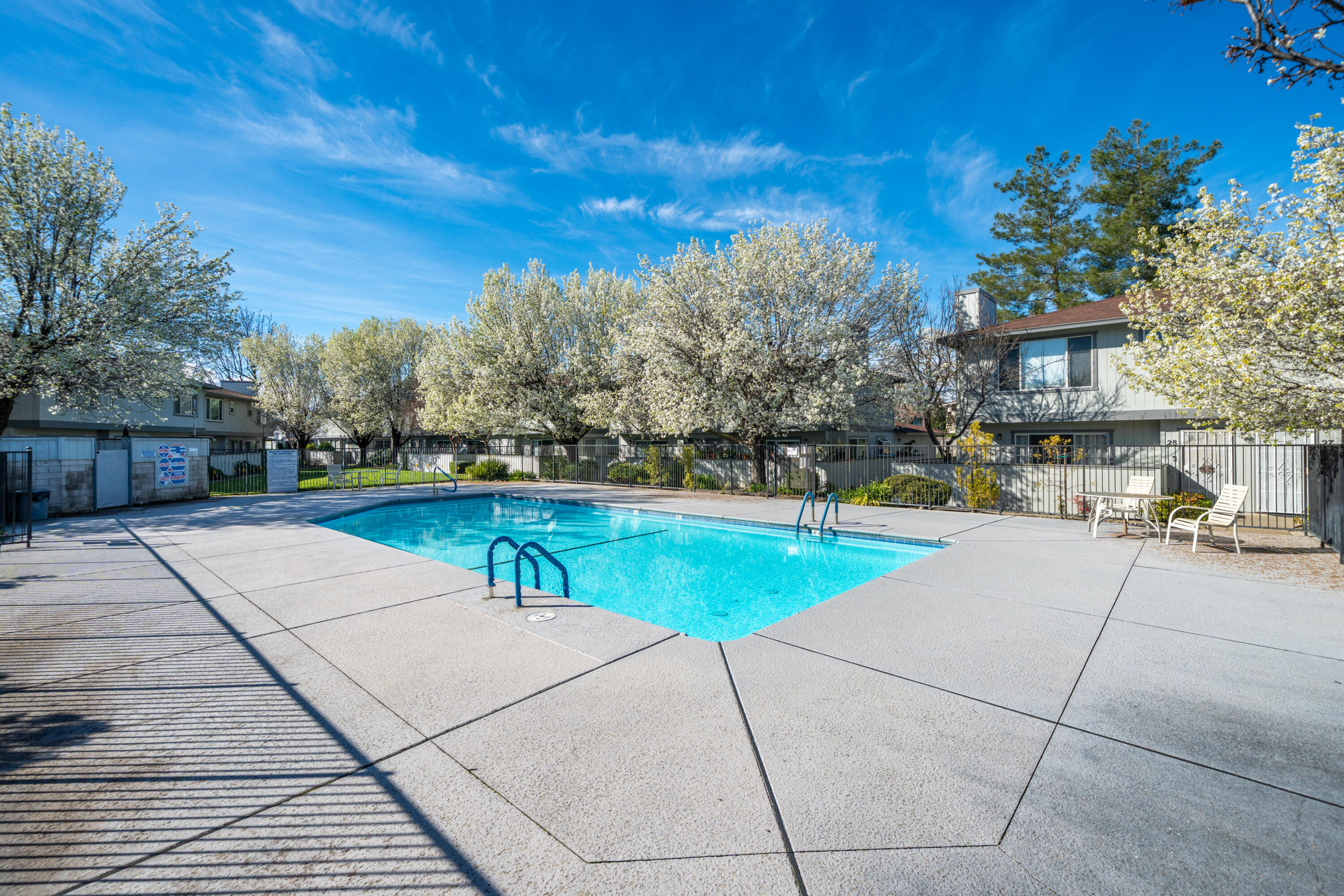200 Ridgetop Drive, Unit 19 Redding, CA 96003 - Photo 36 of 53 a swimming pool with outdoor seating and yard