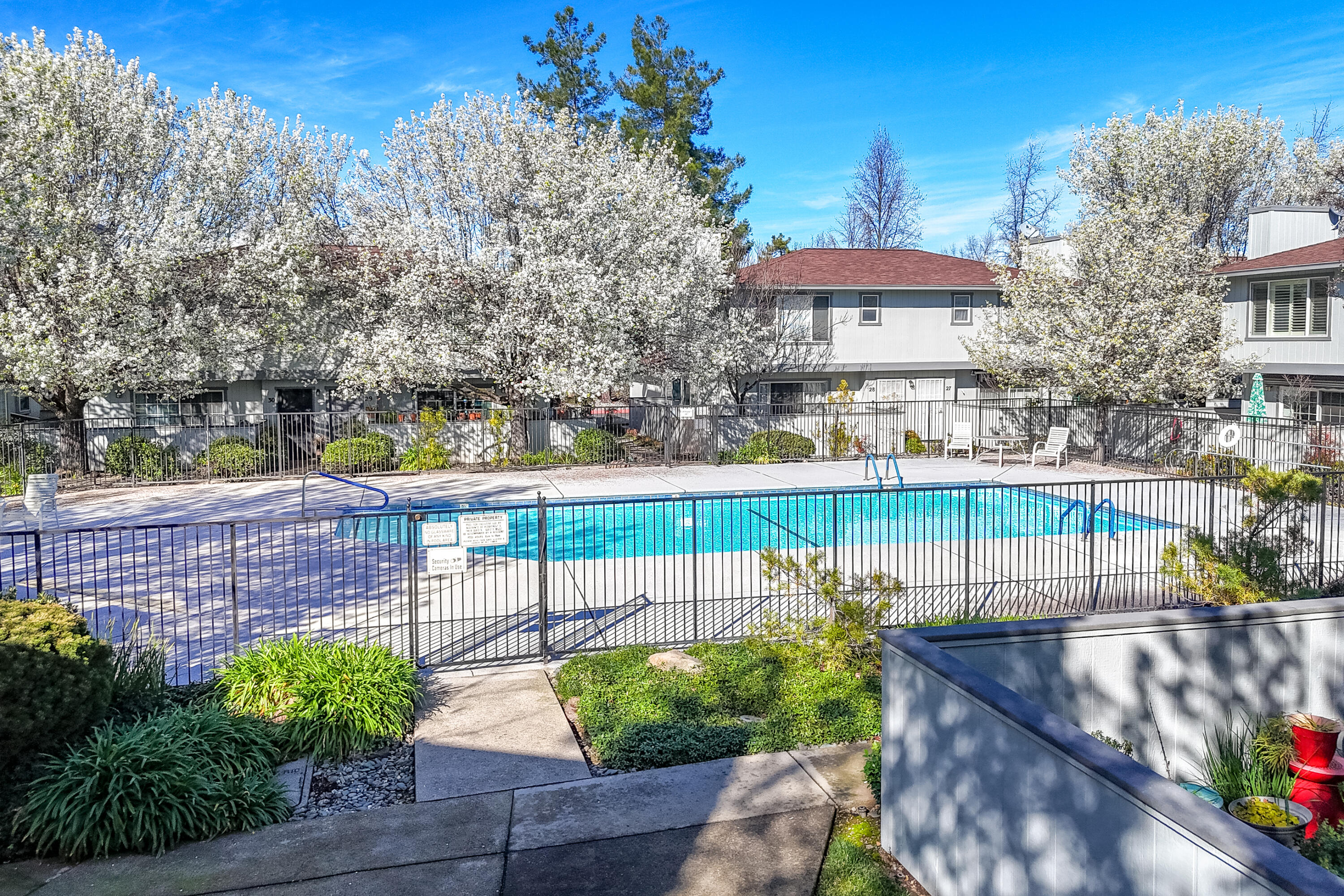 200 Ridgetop Drive, Unit 19 Redding, CA 96003 - Photo 42 of 53 a view of a swimming pool with a patio