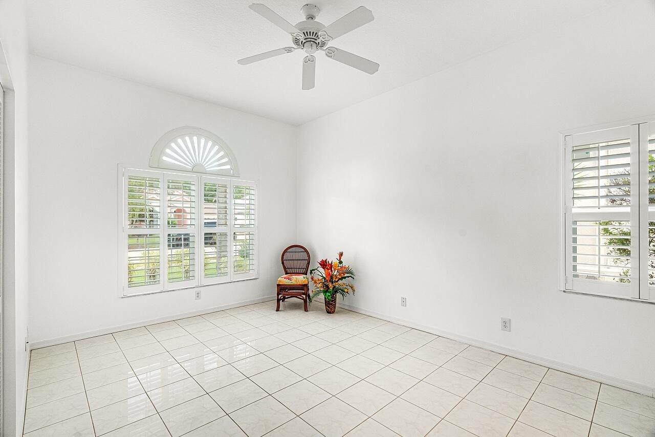 7313 Southeast Seagate Lane Stuart, FL 34997 - Photo 24 of 50 a living room with furniture and a window